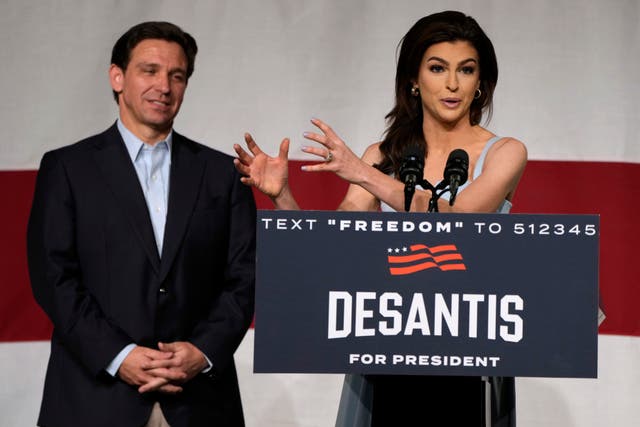 <p>File Republican presidential candidate Florida Gov Ron DeSantis listens to his wife Casey speak during a campaign event </p>
