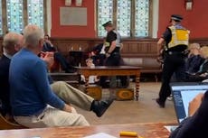 Watch: Trans rights protester who glued hands to floor at Kathleen Stock’s Oxford talk removed by police