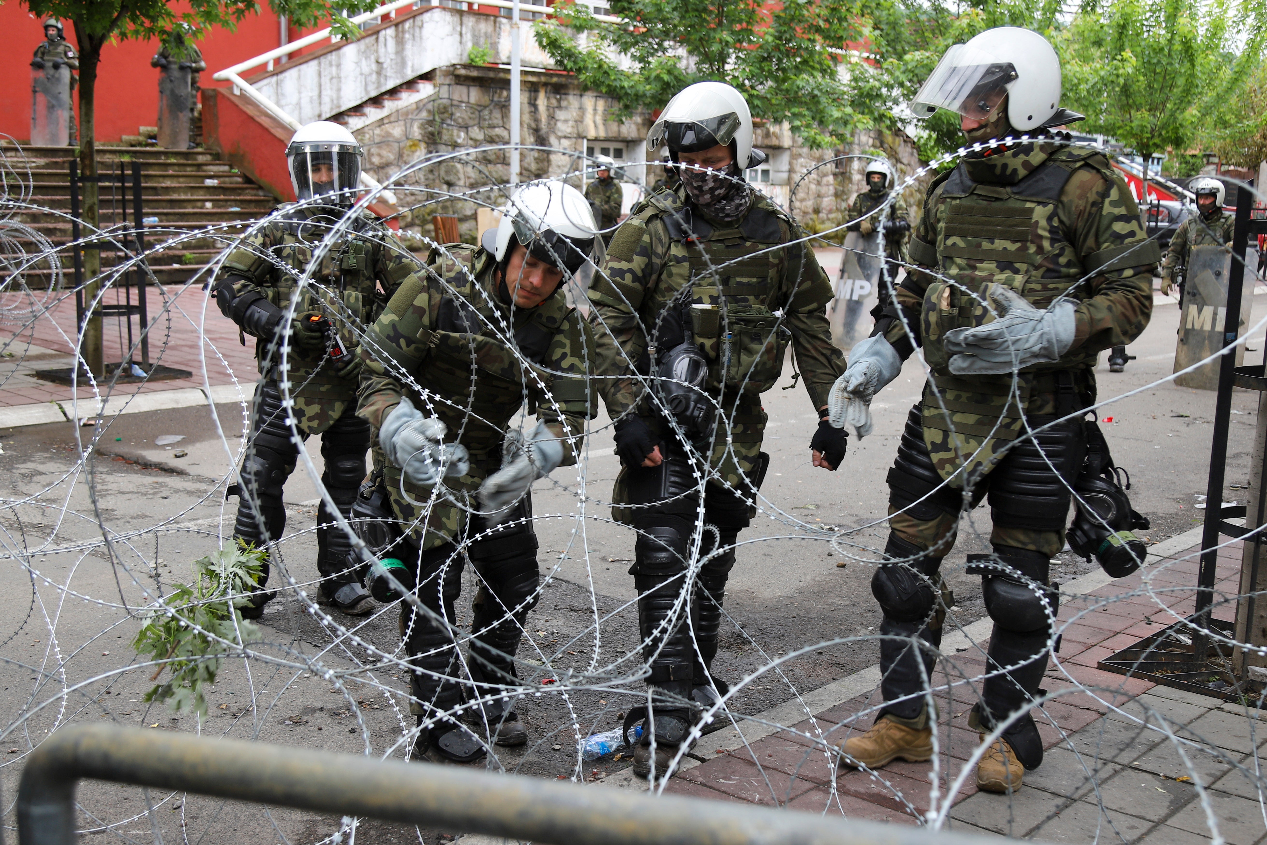 Barbed wire is placed in front of the city hall in the town of Zvecan by Nato peacekeepers on Wednesday