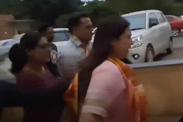 <p>Meenakshi Lekhi (centre) seen here running away from a reporter asking her about India’s top wrestlers protesting sexual harassment </p>