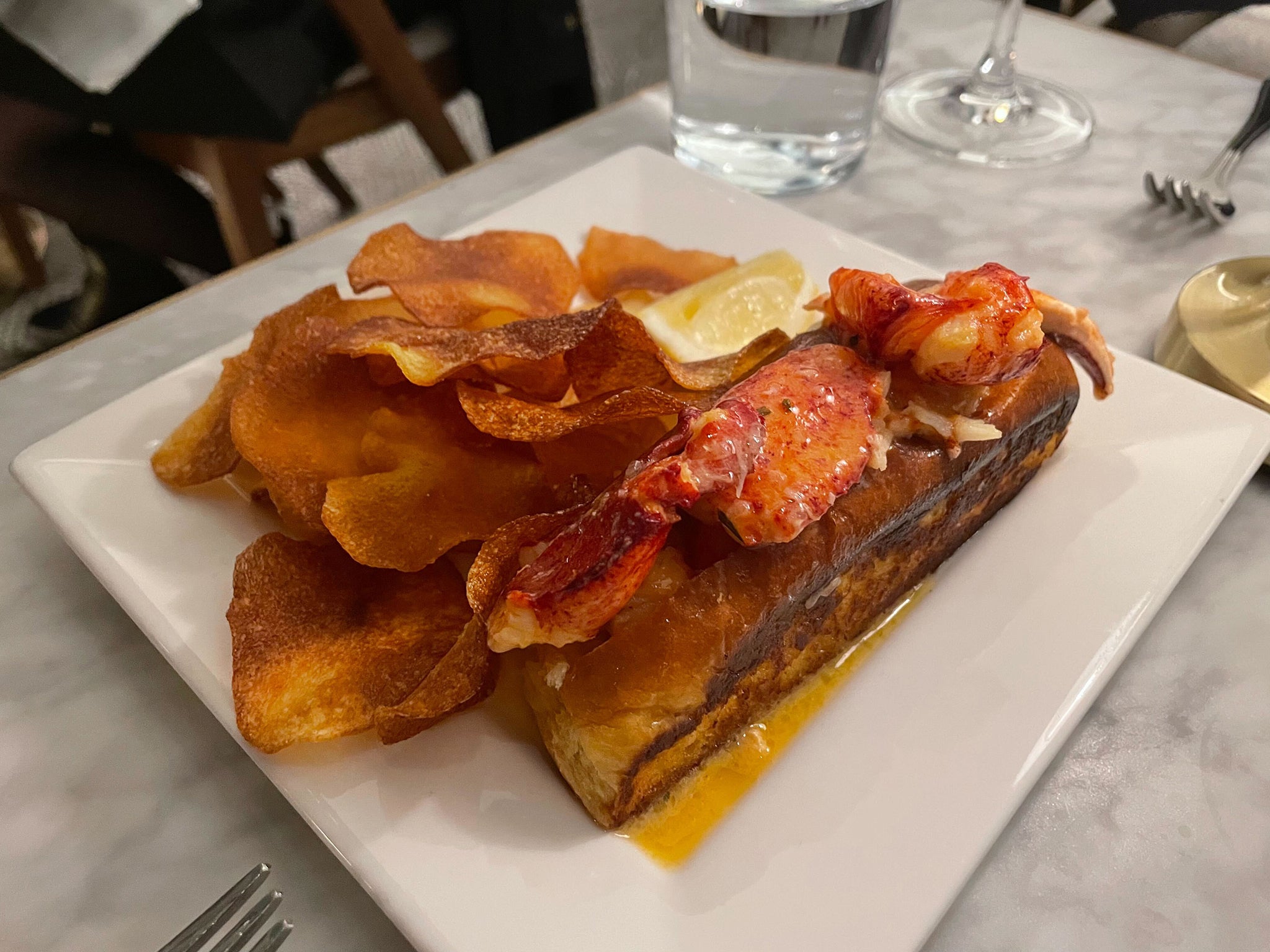 New England lobster roll with house-made crisps are a must-have