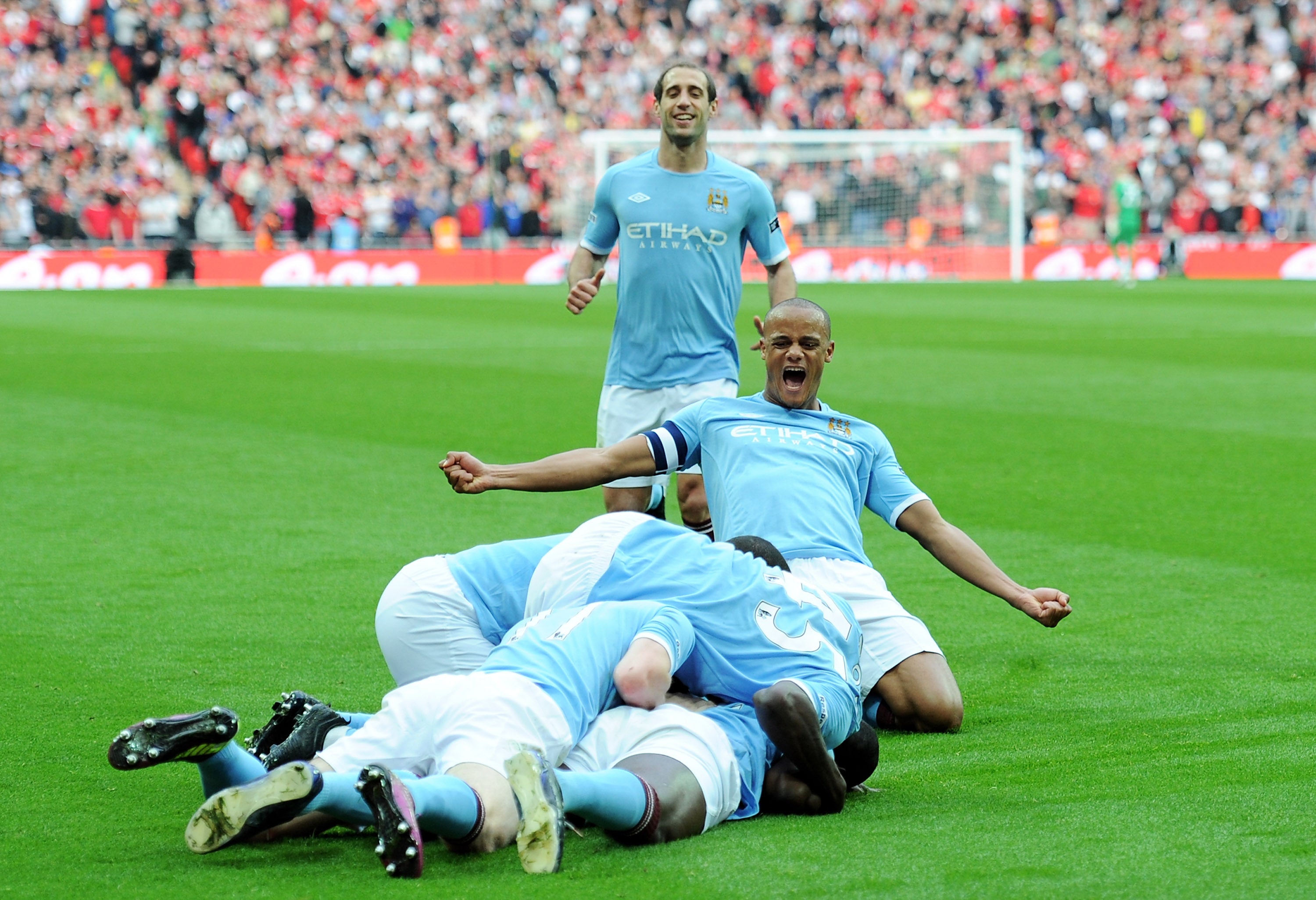 Manchester City players celebrate Yaya Toure’s goal