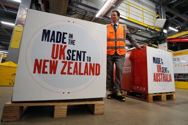 Trade minister Nigel Huddleston during a visit to a DHL facility to watch packages being sent to Australia and New Zealand under fresh trading terms (Jordan Pettitt/PA)