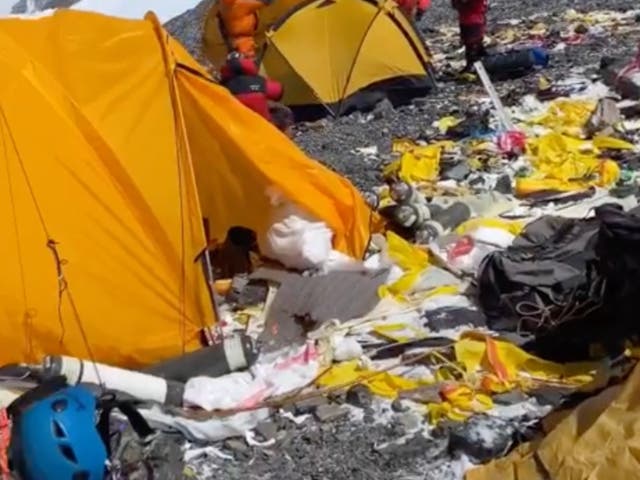 <p>Tenzi Sherpa shared footage of rubbish including empty oxygen bottles, bowls and spoons</p>