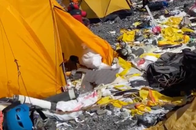 <p>Tenzi Sherpa shared footage of rubbish including empty oxygen bottles, bowls and spoons</p>