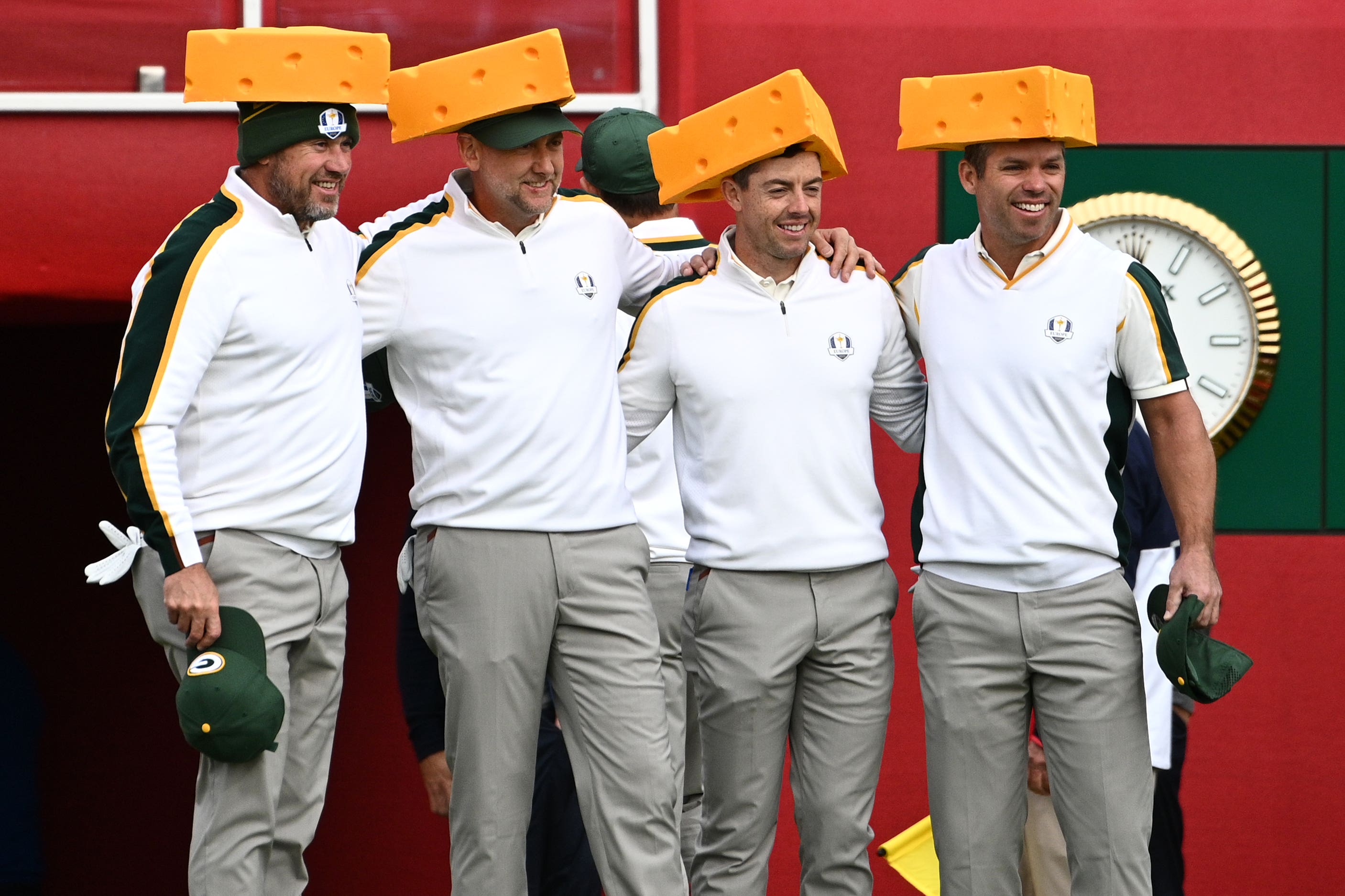 Europe’s Lee Westwood, Ian Poulter, Rory McIlroy and Paul Casey (left-right) arrive on the first tee wearing Green Bay Packers Cheesehead hats in practice ahead of the Ryder Cup (PA Archive)
