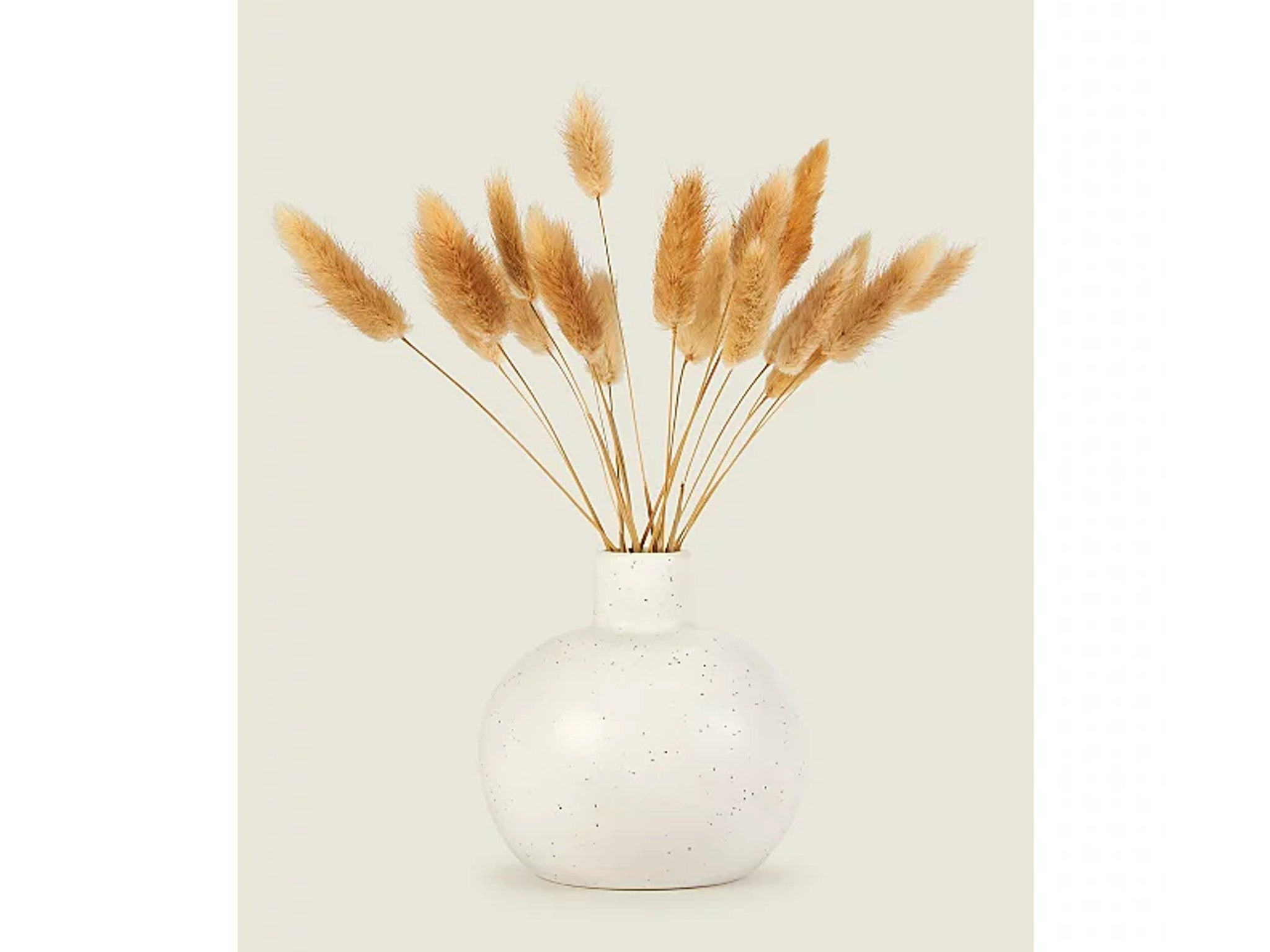 Artificial bunny tails in vase