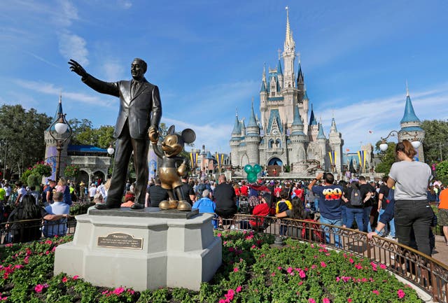 <p>A statue of Walt Disney and Micky Mouse stands in front of the Cinderella Castle at the Magic Kingdom at Walt Disney World in Lake Buena Vista, Fla., Jan. 9, 2019</p>