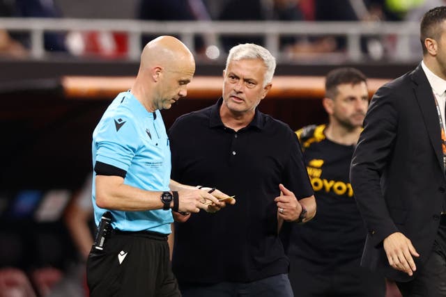 <p>Jose Mourinho argues with referee Anthony Taylor after he is booked during the Europa League final  </p>