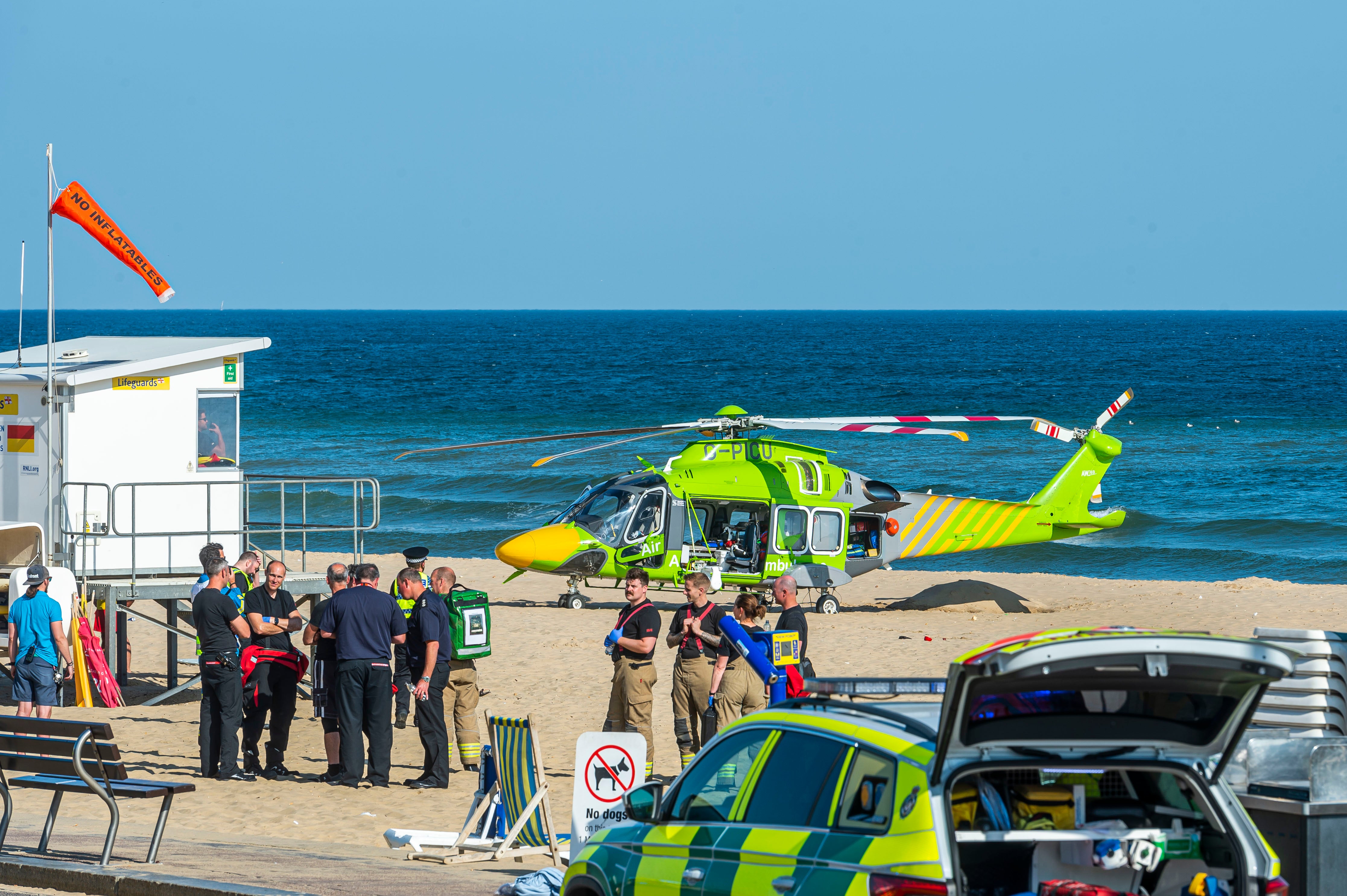 An air ambulance lands on Bournemouth beach