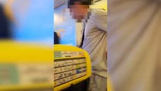 Moment police storm Ryanair flight after man caught smoking in plane toilet