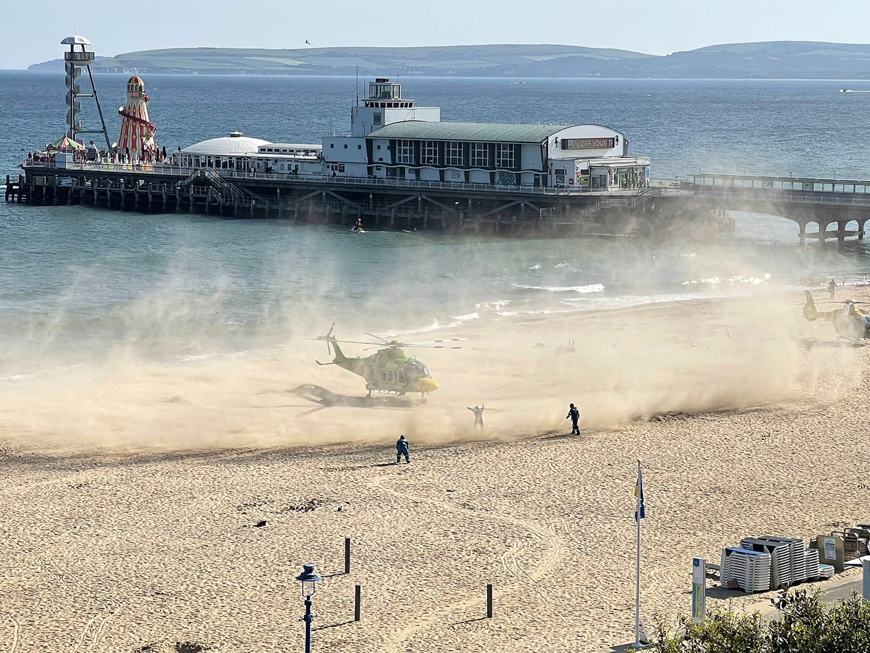 A large section of the beach near the pier was cordoned off, and emergency services personnel took the place of the beachgoers