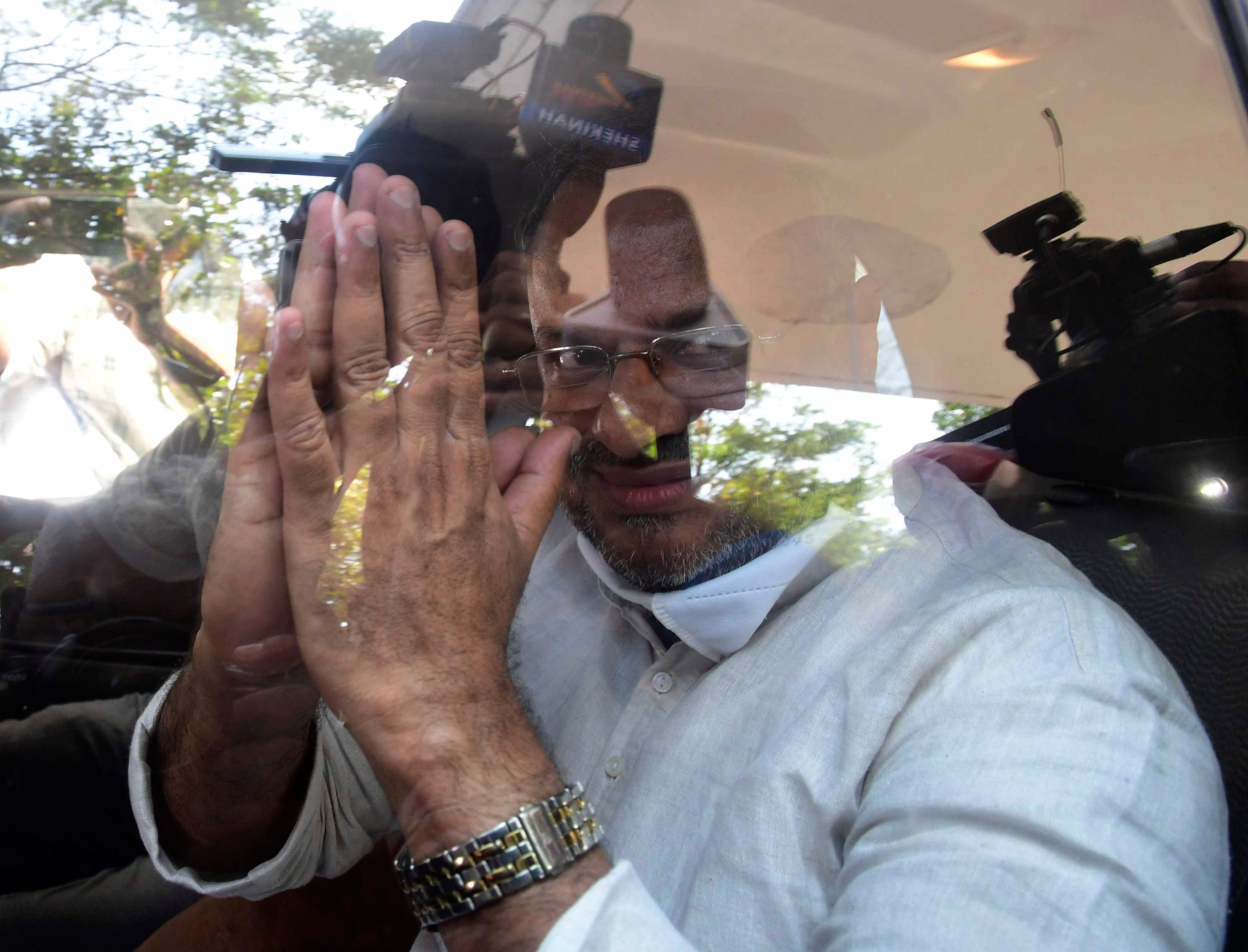 Bishop Franco Mulakkal greets the media as he leaves a court in Kottayam, India on 14 January 2022