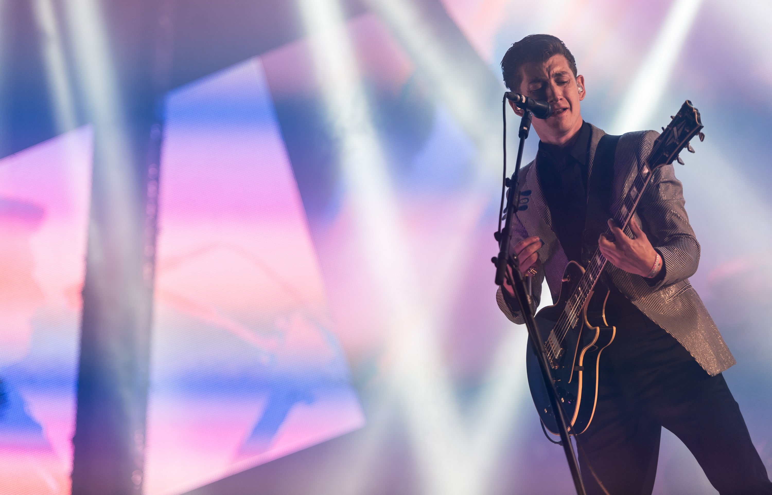 Alex Turner of the Arctic Monkeys performs live on the Pyramid Stage in 2013