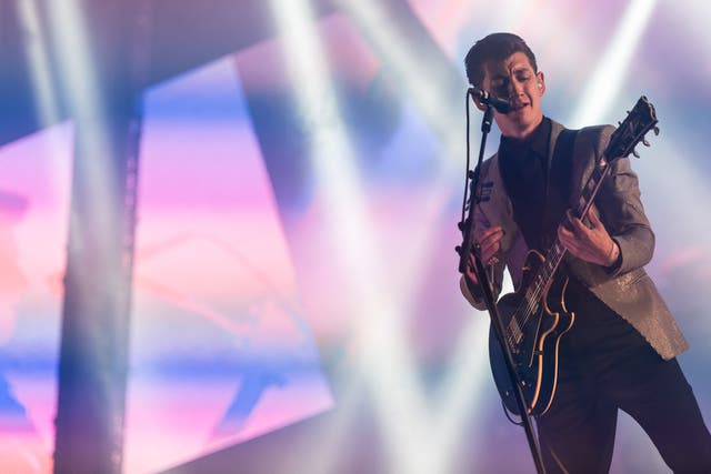 <p>Alex Turner of the Arctic Monkeys performs live on the Pyramid Stage in 2013 </p>