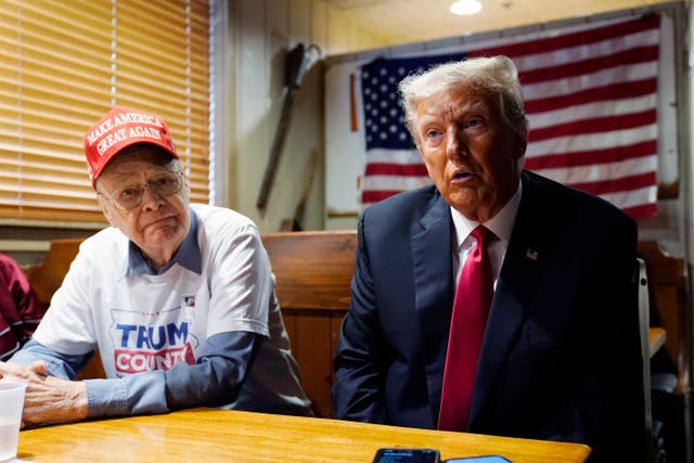 <p>Former President Donald Trump, right, speaks with supporters at the Westside Conservative Breakfast, Thursday, June 1, 2023, in Des Moines, Iowa.</p>