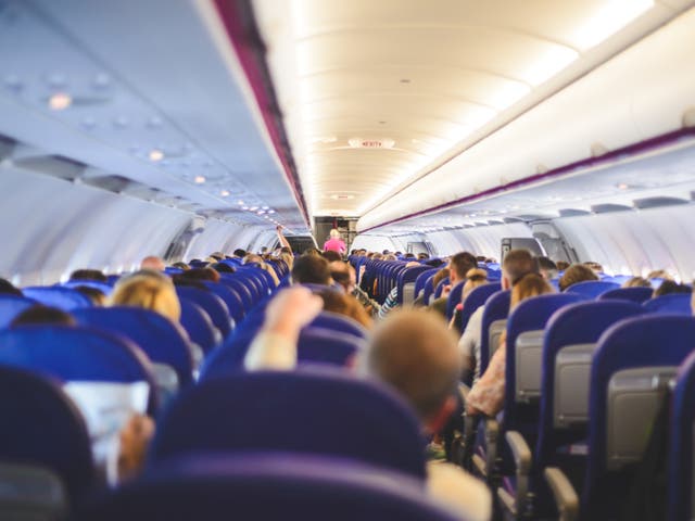 <p>View from inside of a WizzAir airplane full of travelers flying to their destination</p>