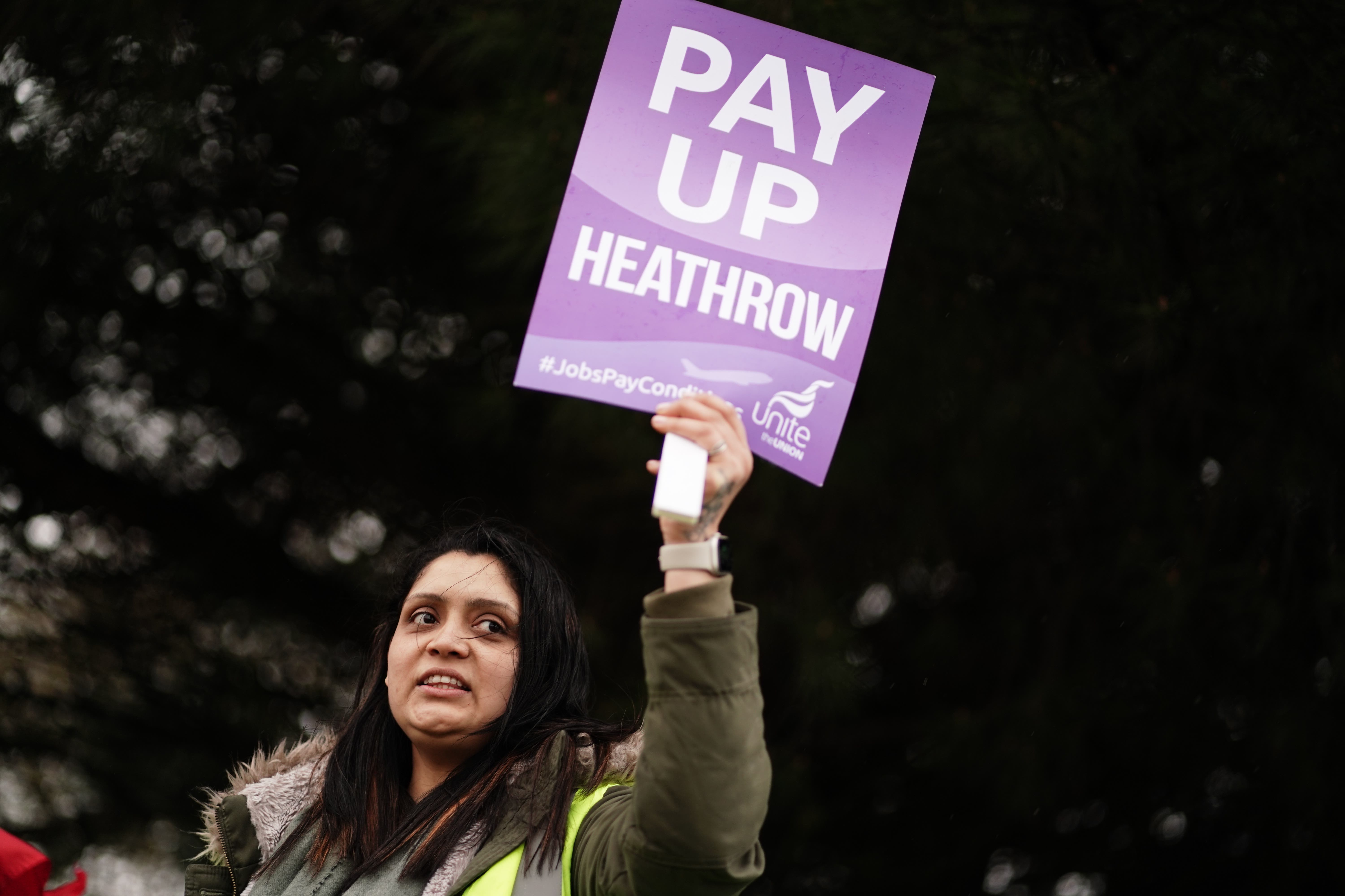 Security guard members of Unite on the picket line at Heathrow (Jordan Pettitt/PA)