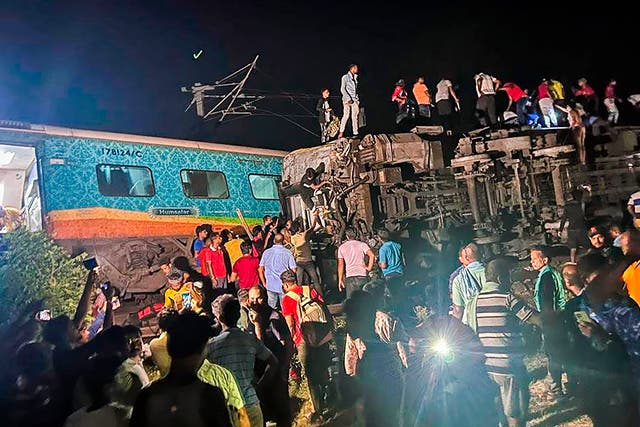 <p>Rescuers work at the site of passenger trains that derailed in Balasore district, in the eastern Indian state of Odisha </p>