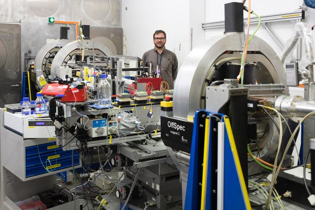 Dr Luke Clifton standing in front of the advanced Offspec instrument at the ISIS Neutron and Muon Source in Oxfordshire that produced real time images of processes taking place inside cells for the study (STFC ISIS Neutron and Muon Source)