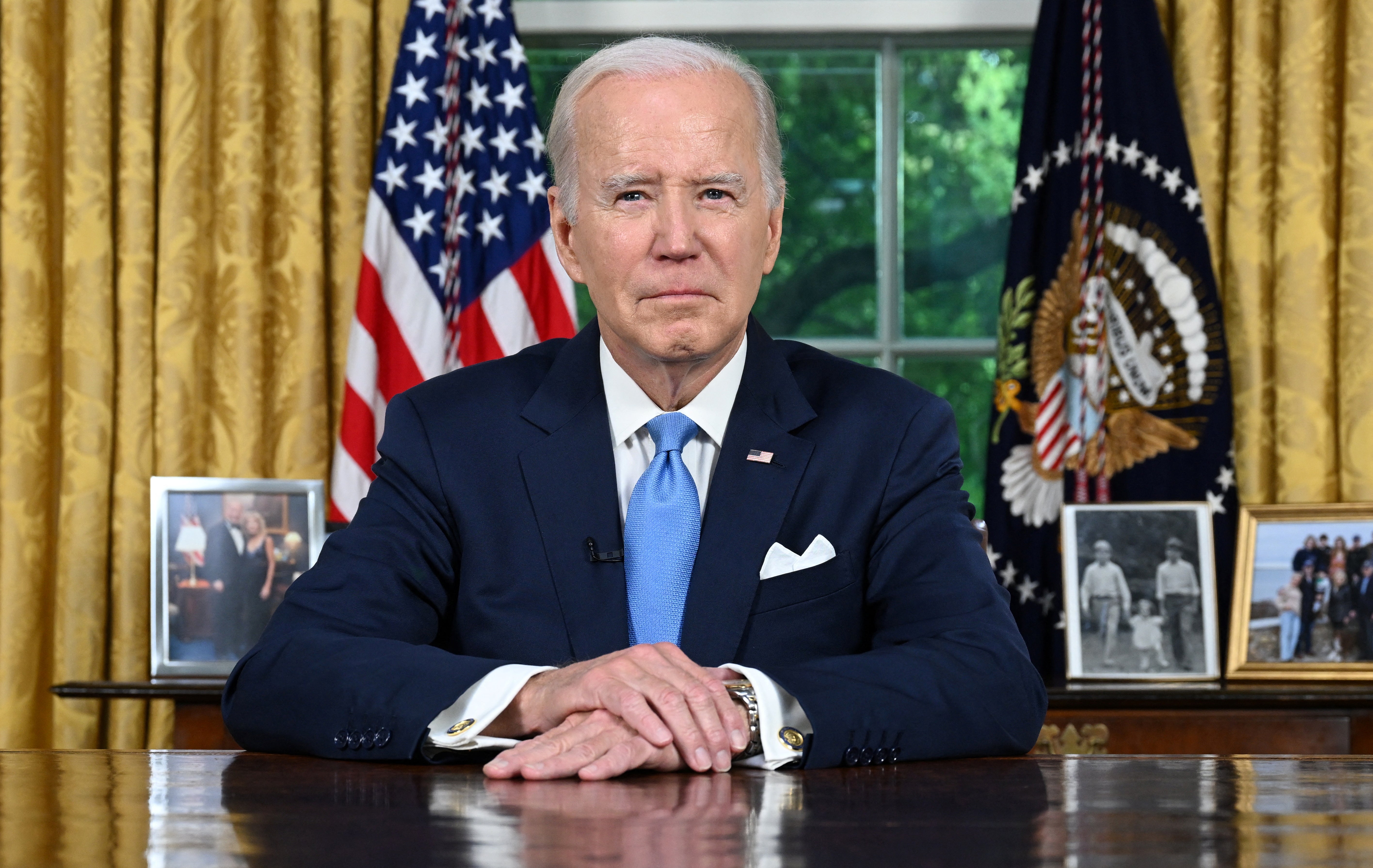 US President Joe Biden sit at his desk ahead of addressing the nation on averting default and the Bipartisan Budget Agreement, in the Oval Office of the White House in Washington, DC, June 2, 2023
