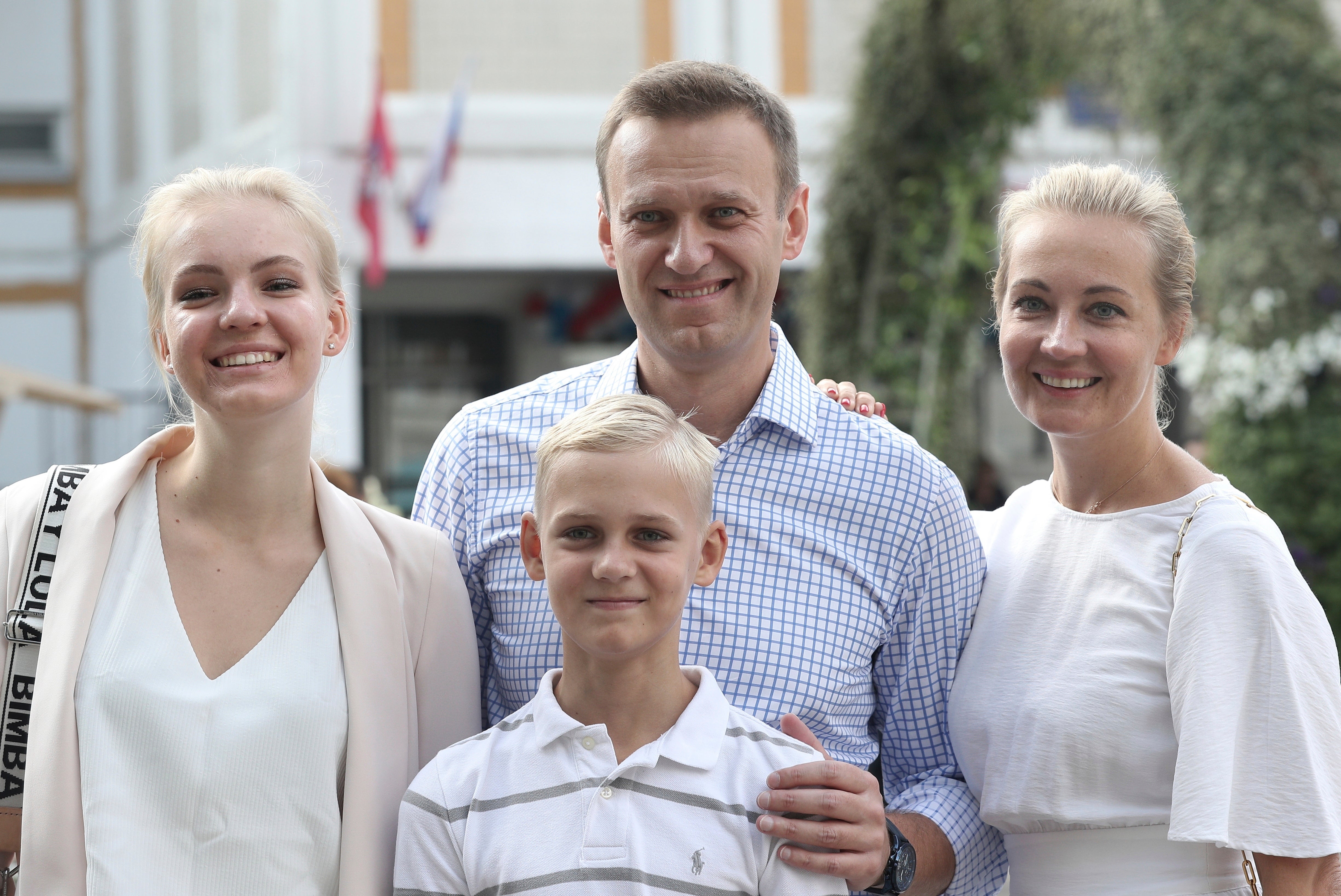 Russian opposition leader Alexei Navalny, with his wife Yulia, right, daughter Daria, and son Zakha in 2019