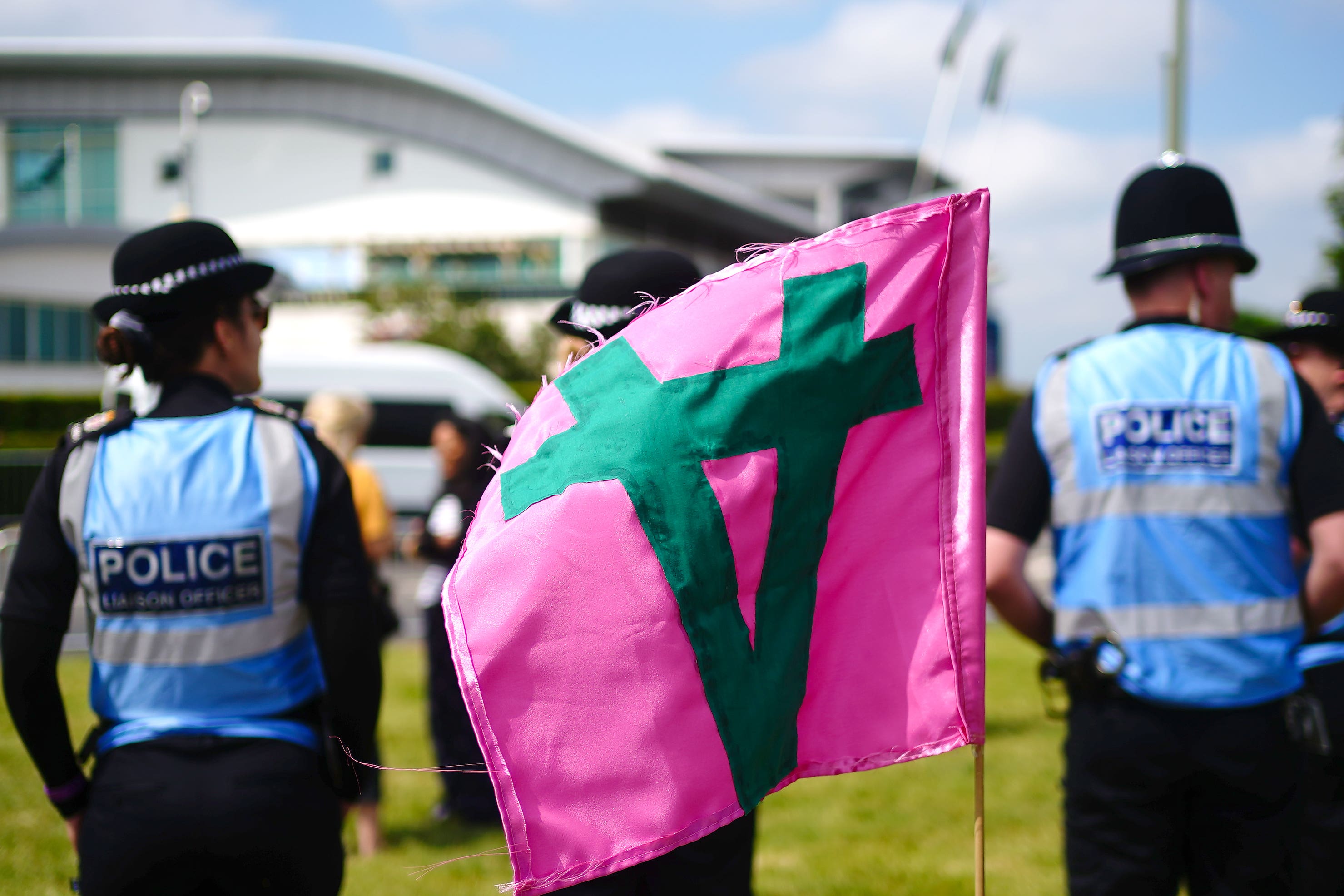 Police Liaison Officers look on in the area where Animal rights protest group Animal Rising are during Derby Day of the 2023 Derby Festival at Epsom Downs Racecourse, Epsom (Victoria Jones/PA)