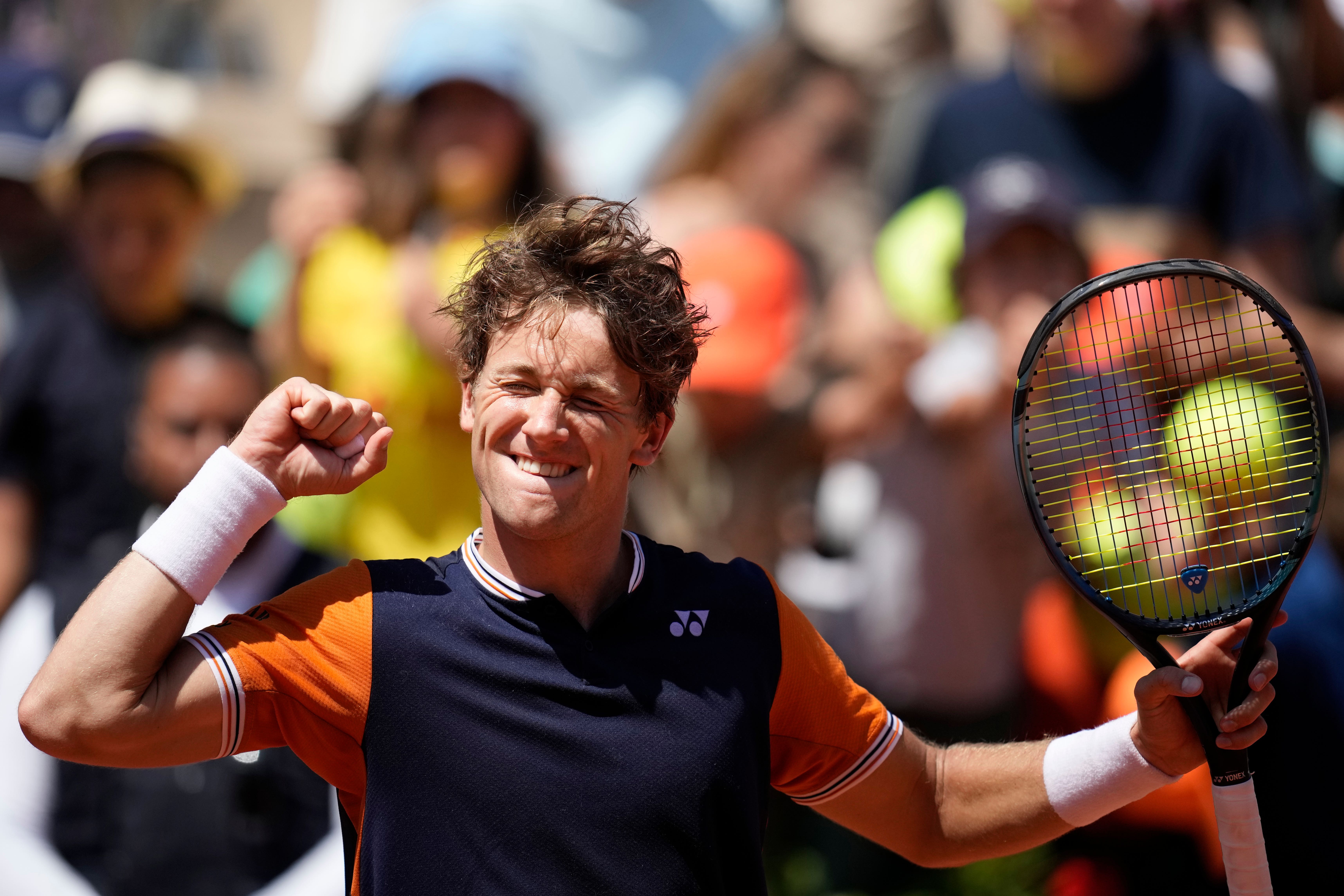 Casper Ruud celebrates reaching round four (Christophe Ena/AP)