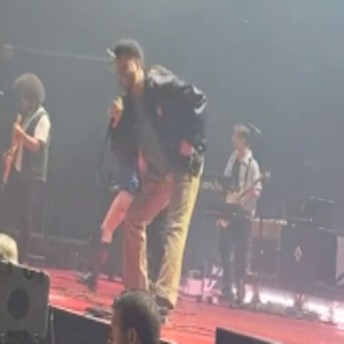 Rock singer apologizes for urinating on man on stage at Florida