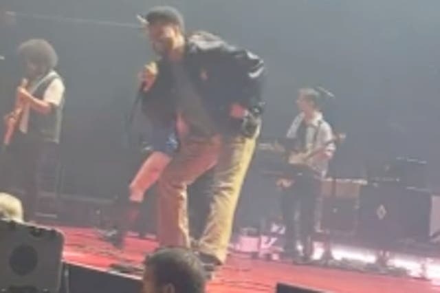 <p>Florida Rep Maxwell Frost is seen on stage at a Paramore concert on 2 June</p>