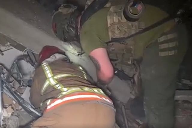 <p>Rescue workers search rubble in Ukraine</p>