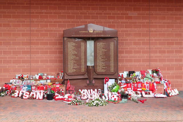 Flowers and tributes left at the Hillsborough Memorial outside Anfield stadium in Liverpool (Peter Byrne/PA)