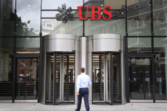 Swiss banking giant UBS has said it expects to complete the acquisition of Credit Suisse as early as June 12 (Philip Toscano/PA)
