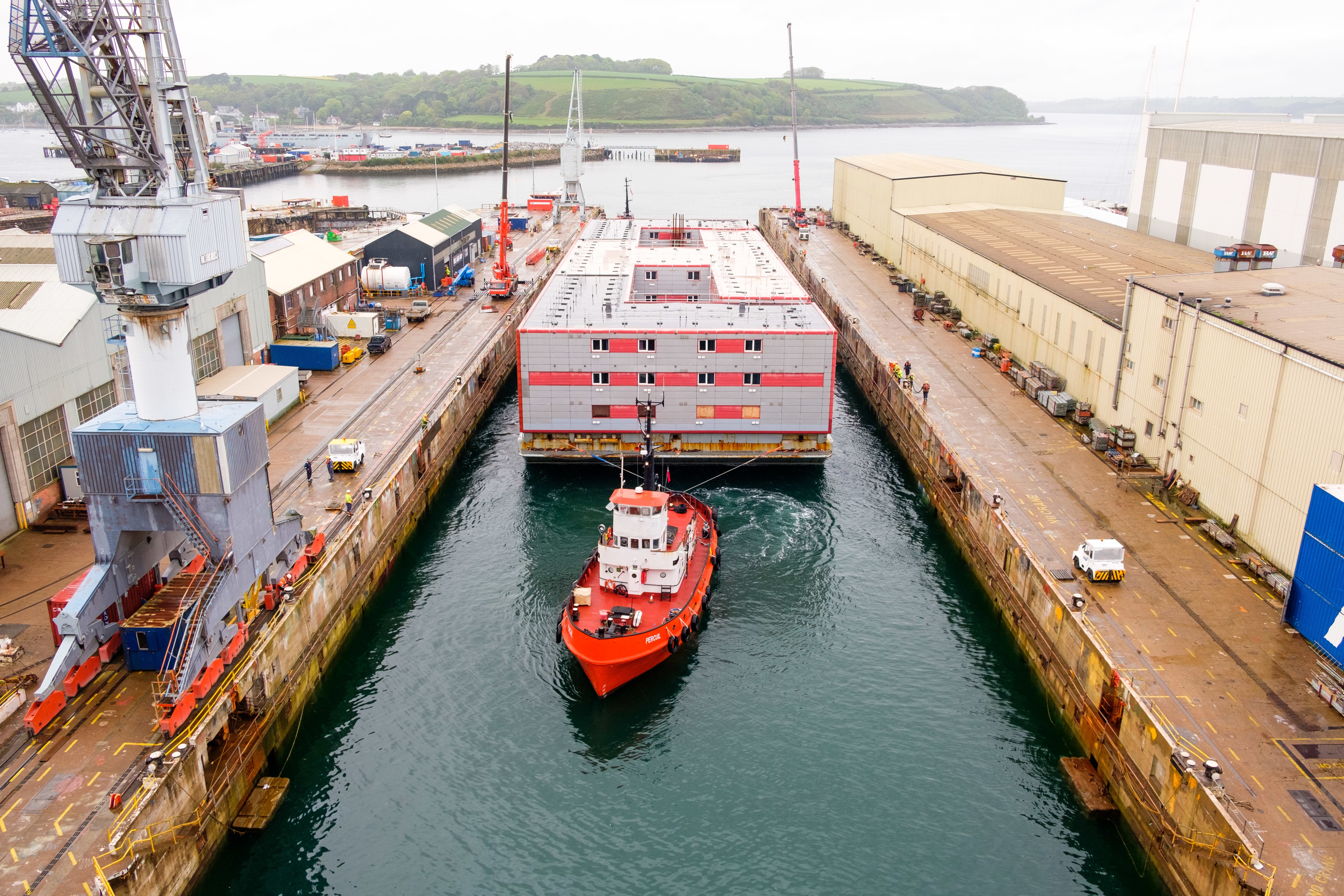 The Bibby Stockholm accommodation barge is being refitted to increase its capacity from 222 to 506 occupants in Falmouth docks in Cornwall (PA)