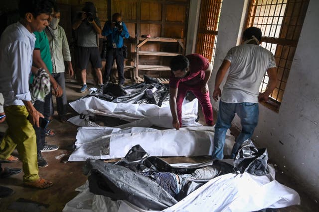 <p>Bodies are seen at a high school used as temporary mortuary to identify the dead recovered from the carriage wreckage of a three-train collision near Balasore, Odisha</p>