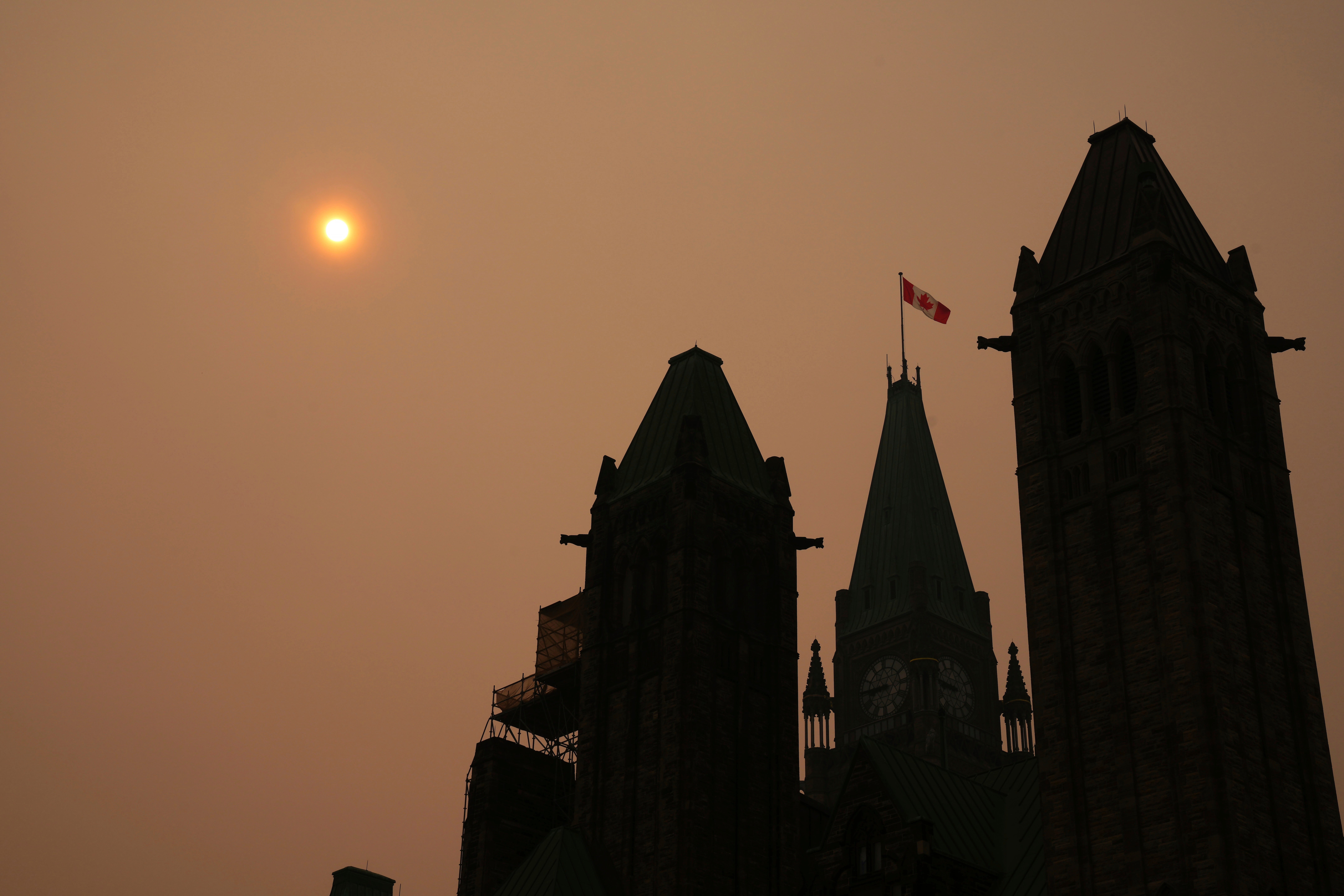 Smoke from wildfires in Ontario and Quebec is shown over Parliament Hill in Ottawa on Tuesday