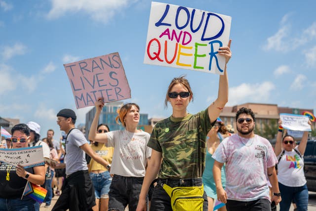 <p>Demonstrators march to the Texas State Capitol on 13 April to protest anti-LGBT+ legislation. </p>