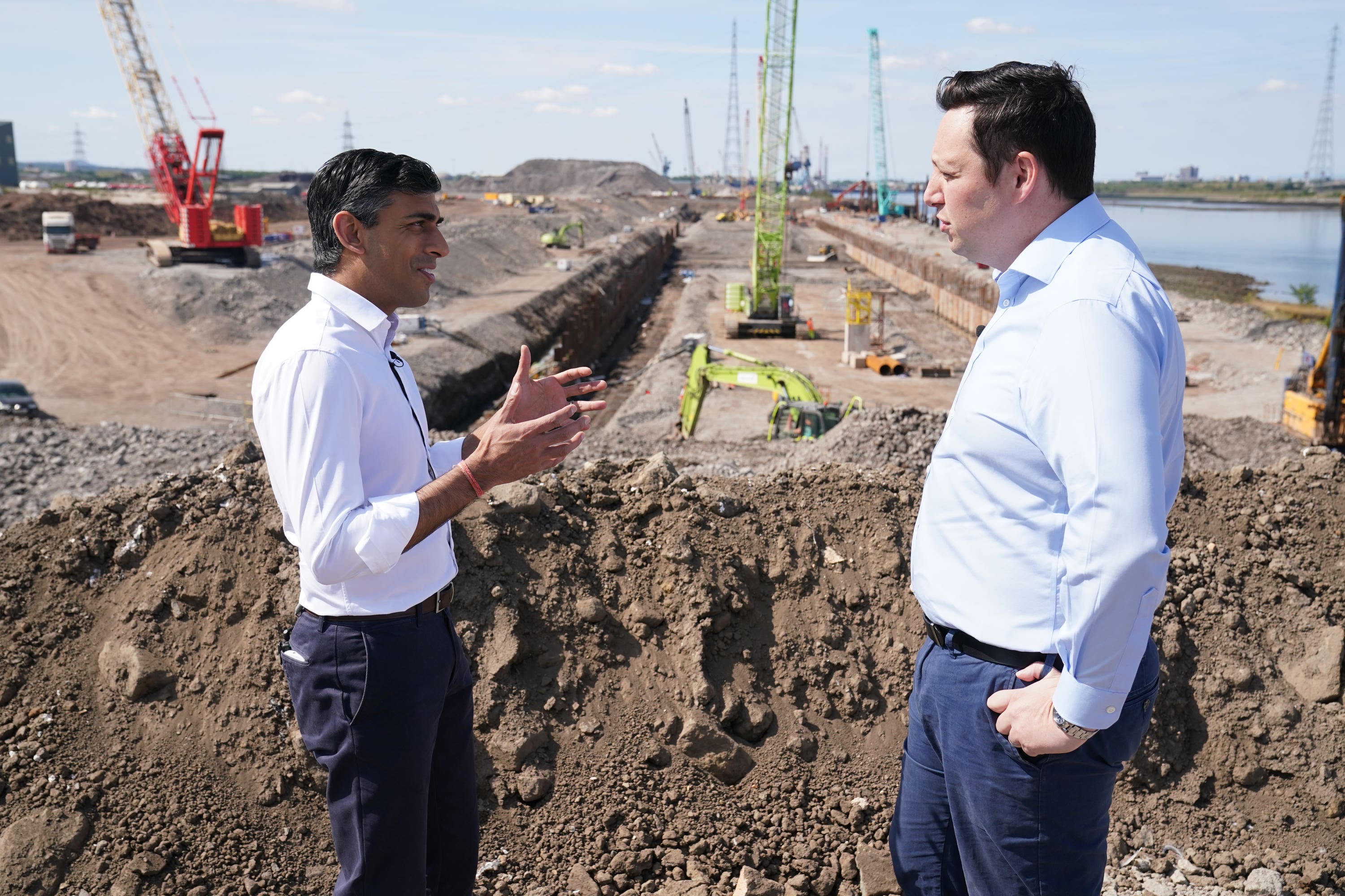 Rishi Sunak (left) speaks with Tees Valley Mayor, Ben Houchen, during a visit to Teesside Freeport, Teesworks, in Redcar, Teeside, as he outlines his vision for the future of Britain, as part of his campaign to become the next leader of the Conservative and Unionist Party and Prime Minister. Picture date: Saturday July 16, 2022.