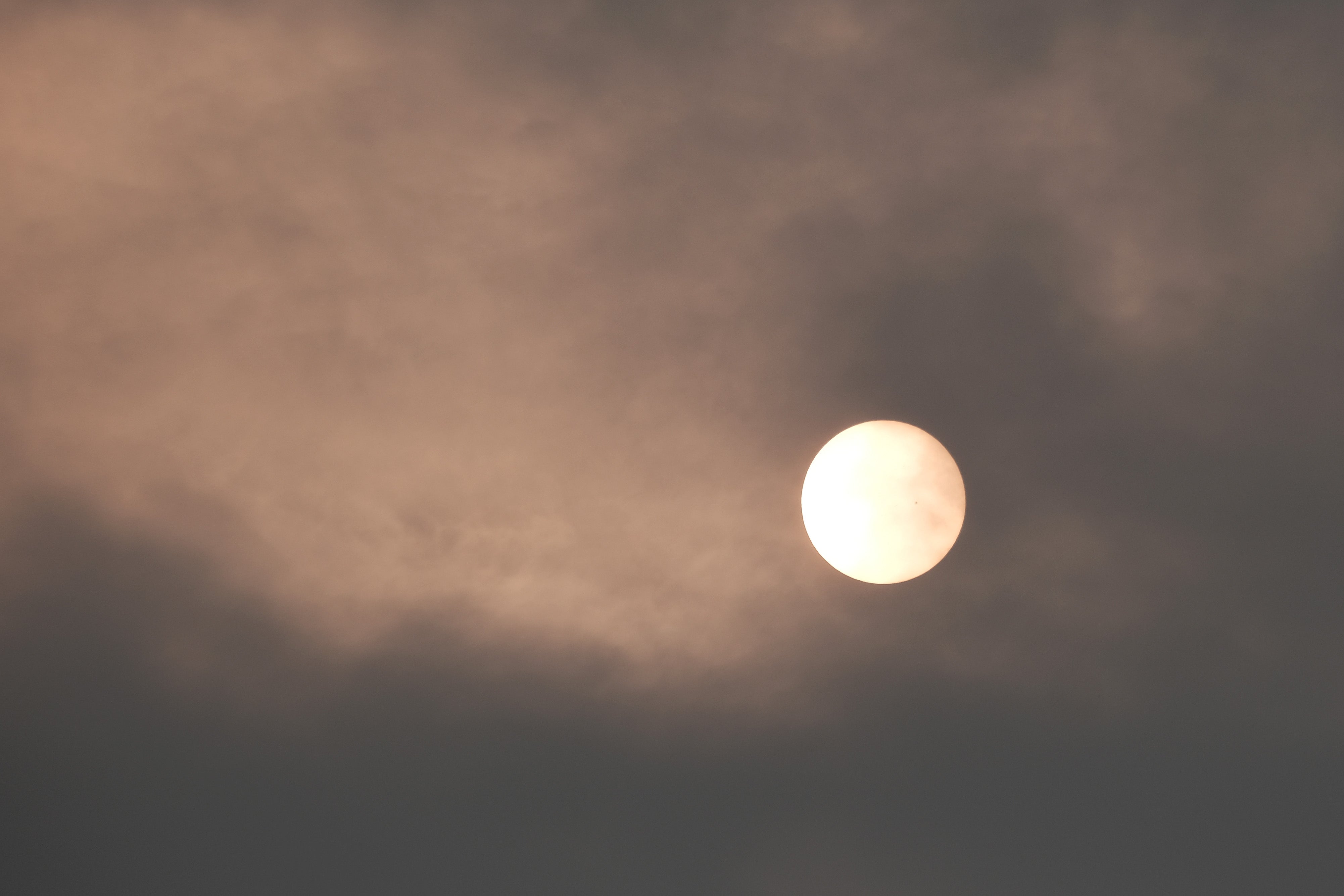 The sun over New York City takes on a red appearance on a hazy morning resulting from Canadian wildfires