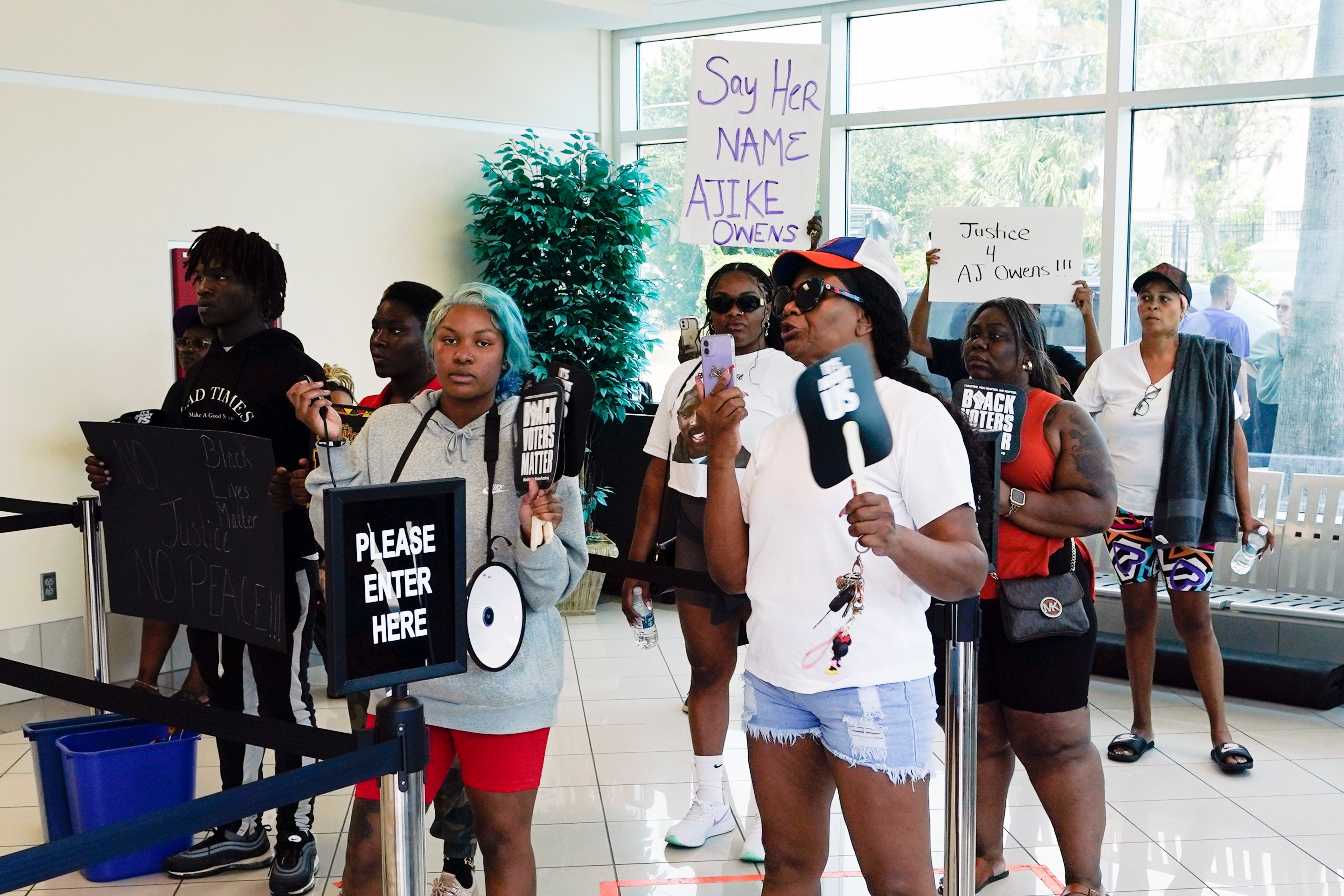 Protesters gather in the lobby of the Marion County Courthouse on Tuesday