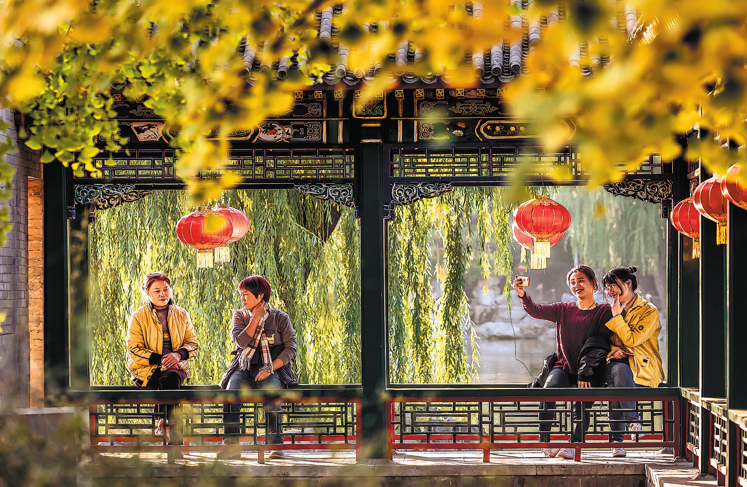 Residents enjoy their spare time in a small garden beside a hutong