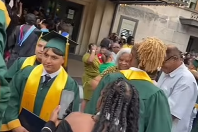 <p>A screengrab from the video uploaded to Facebook of gunfire erupting at the Huguenot High School graduation ceremony in Richmond, Virginia</p>
