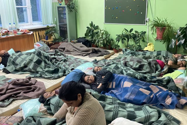 <p>Air India passengers wait inside a makeshift accommodation of a school dormitory in a Russian village Magadan </p>