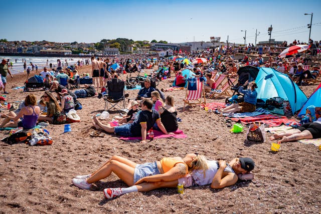 A 30C heatwave set to scorch the UK has led to the year’s first heat health alert (PA)