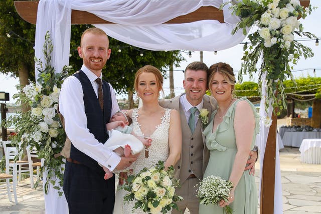 Bride and groom Michael and Gemma O’Shea with bridesmaid Lauren, her husband, and their baby, after airline Tui flew out her bridesmaid’s dress to save the day (TUI/PA)