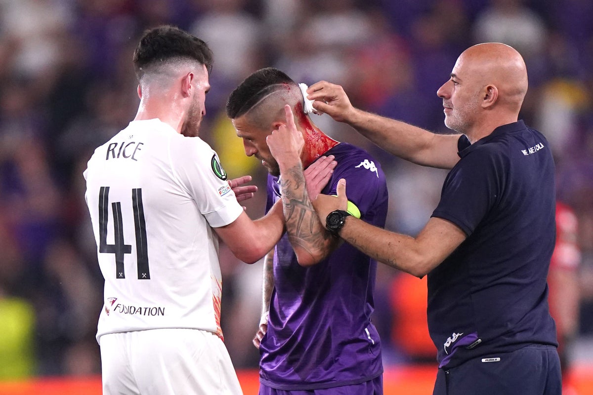 Fiorentina’s Cristiano Biraghi struck by object thrown from West Ham fans
