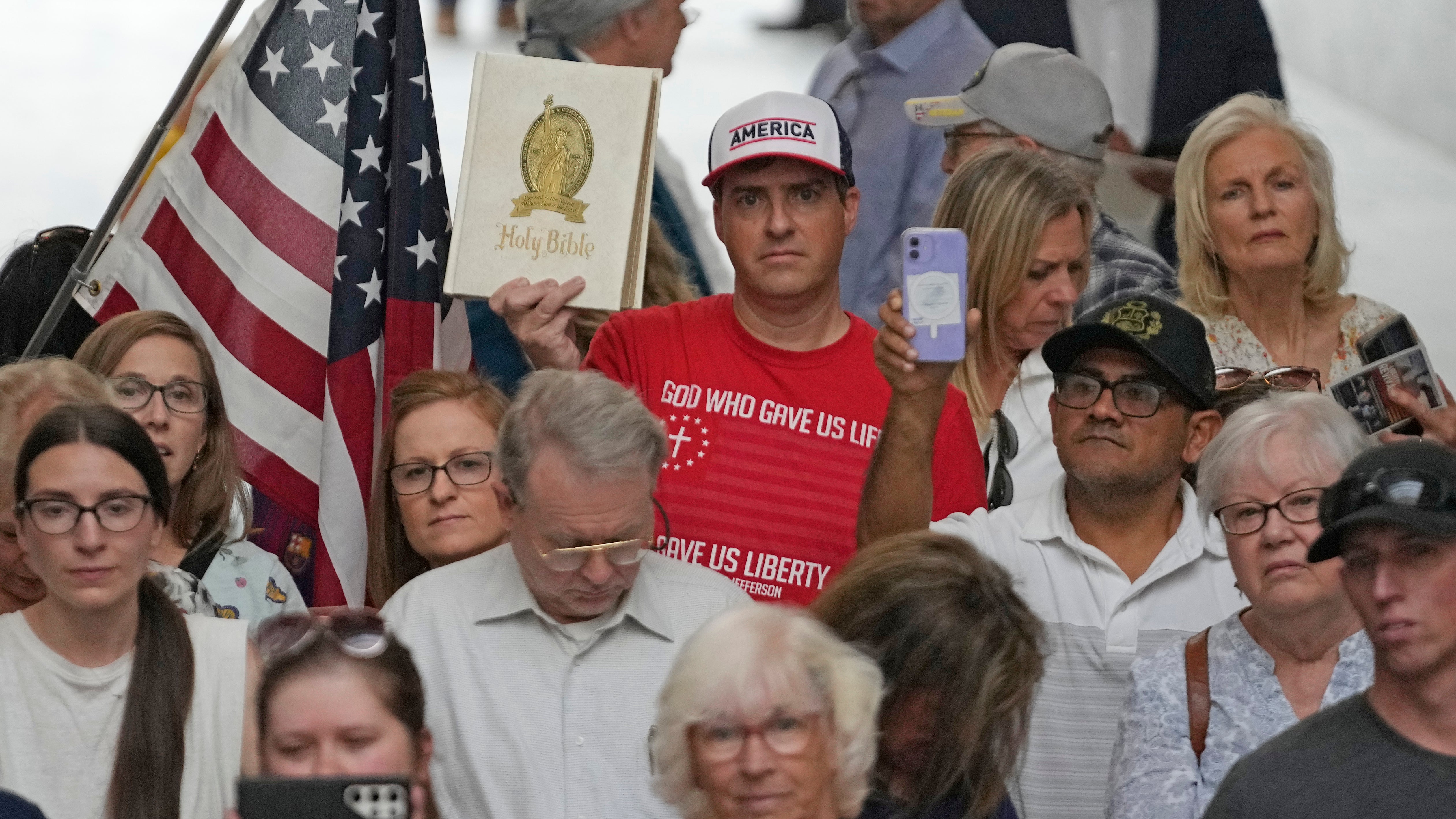 People gather during a rally Wednesday, 7 June 2023, at the Utah State Capitol, in Salt Lake City. Bible-toting parents and Republican lawmakers convened on Utah’s Capitol to protest a suburban school district that announced it had removed the Bible from some schools last week