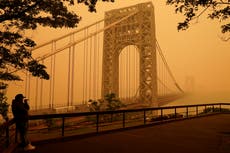 Watch: New York City bridge obscured by eerie haze from Canada wildfires