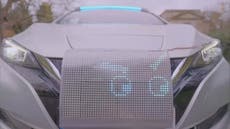 ‘Robot taxi’ with smiling face and ‘ghost driver’ interacts with pedestrians in new experiment