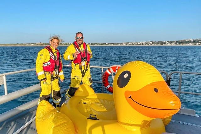Three people on a giant inflatable duck had to be rescued after it drifted out to sea (RNLI/Matthew Rowe/PA)